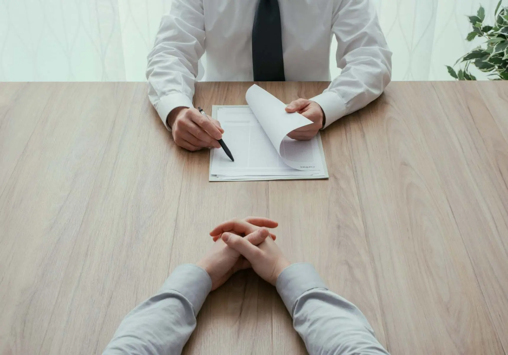 Business meeting across a desk Belinos Consulting accounting London