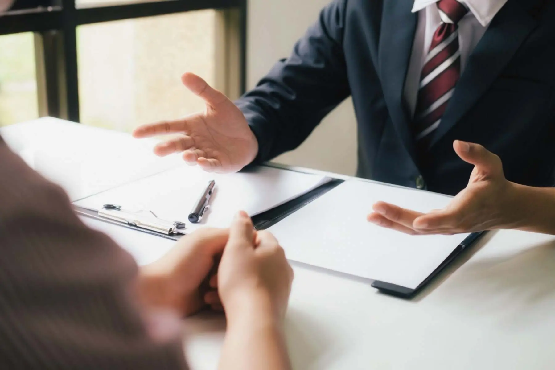 Business consultant advising a client Belinos Consulting London