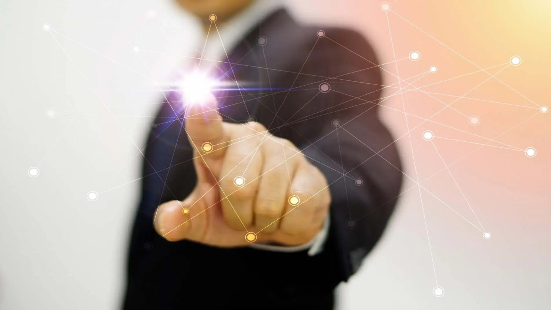 Business man pointing at a screen Belinos Consulting administration services London