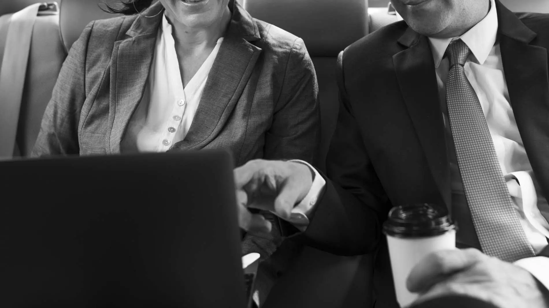 Business people meeting and working in a car Belinos Consulting secretarial services London