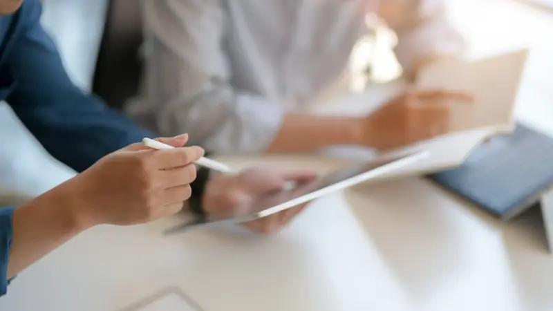 Accountant analysing business figures on a computer Belinos Consulting Arrow visit preparation