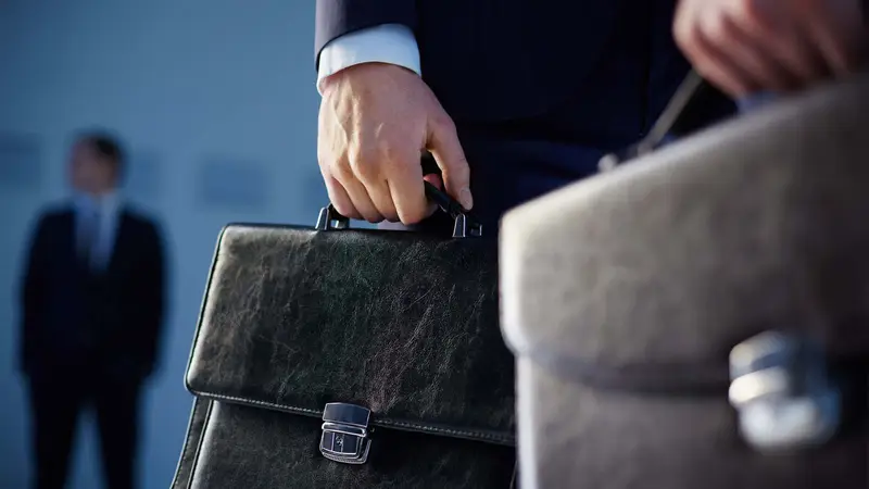Business partners in discussion Belinos Consulting compliance management London
