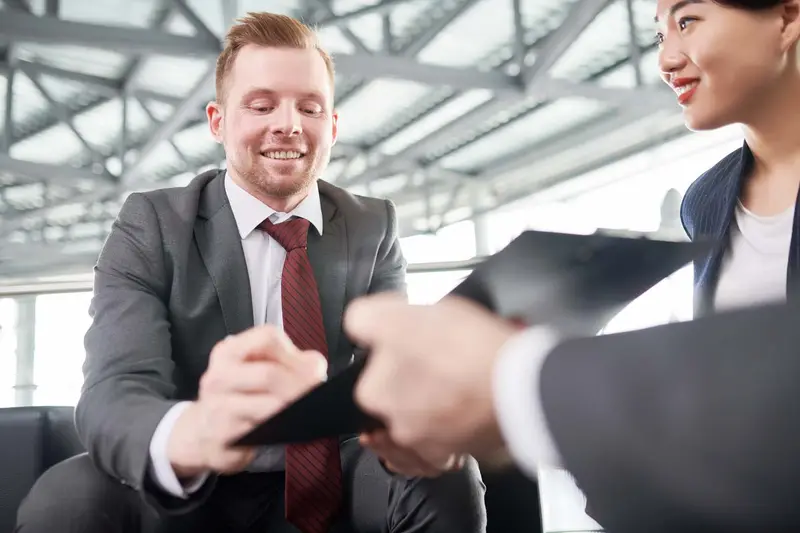 Entrepreneur signing a contract Belinos Consulting financial crime review London
