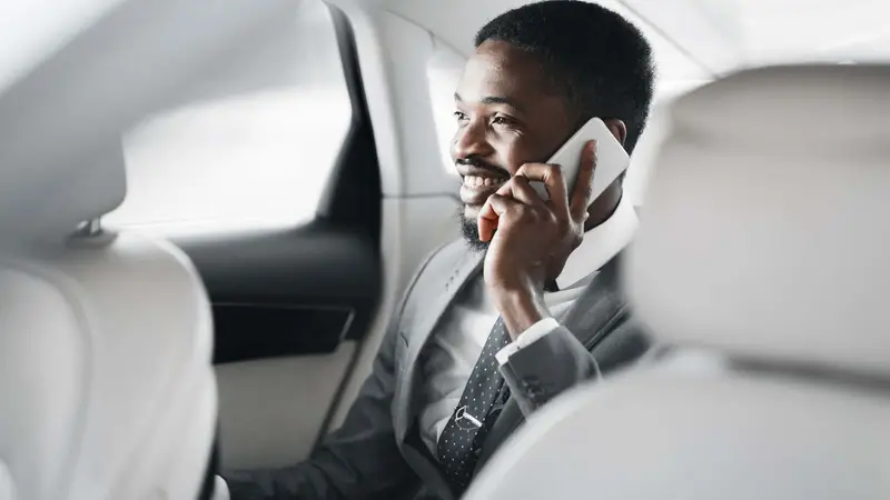 Businessman talking on a mobile phone Belinos Consulting regulatory training London